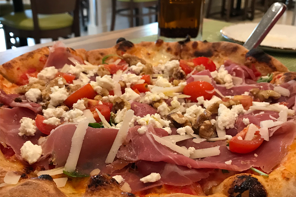 Wood-fired pizza at il Pomod'Oro, made with fresh, all-natural ingredients and traditional techniques.