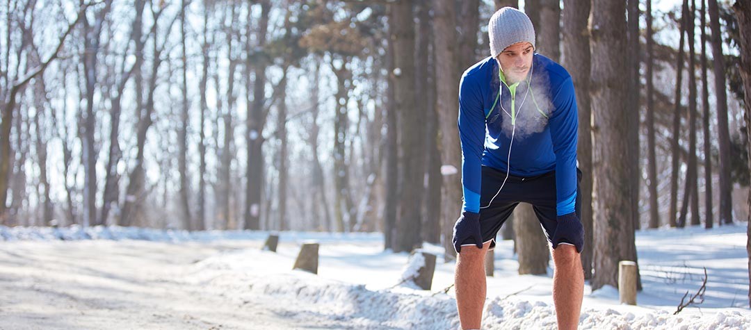 How To Train In The Cold—cover image introducing cold-weather running challenges and preparation for local races.
